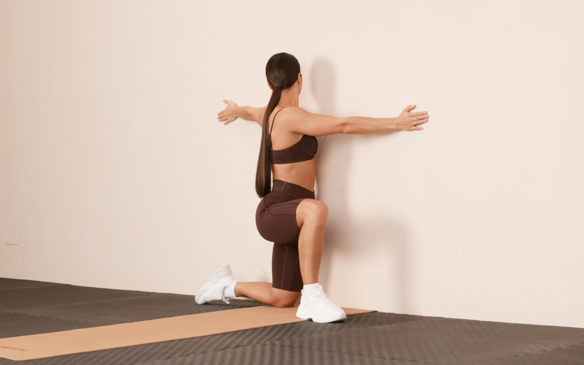 Posture awareness exercise standing near a wall